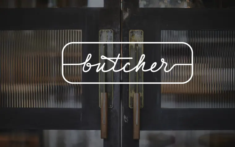 The Butcher's previous website: a photograph of the doors with a logo over it.